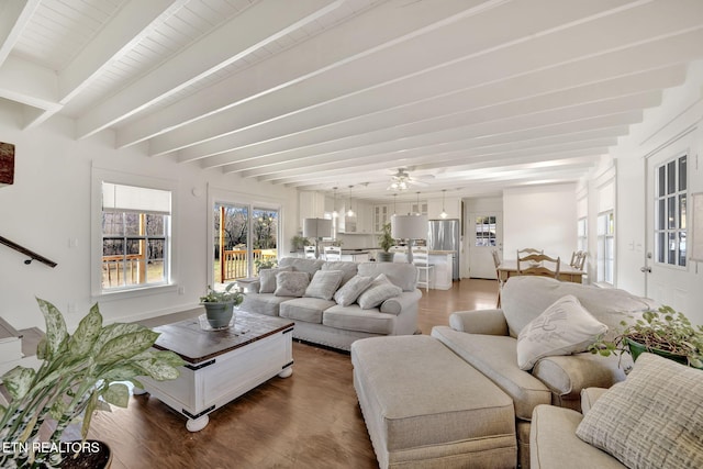 living room featuring hardwood / wood-style flooring and beamed ceiling