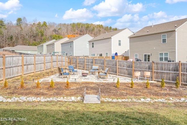 view of yard featuring a patio and a fire pit