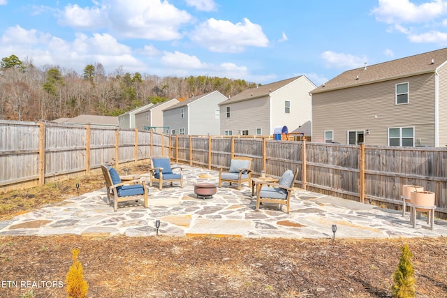 view of patio featuring an outdoor fire pit