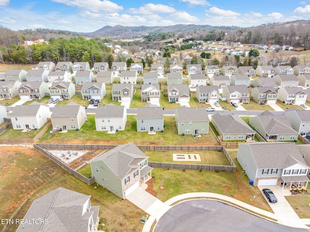 birds eye view of property featuring a mountain view