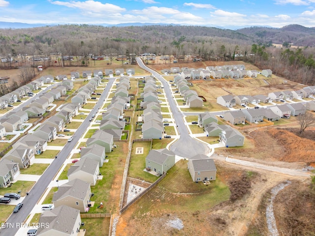 birds eye view of property with a mountain view