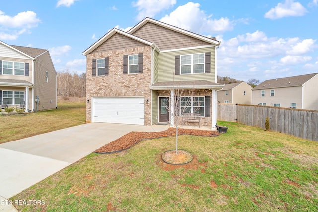 view of front of house featuring a garage and a front yard