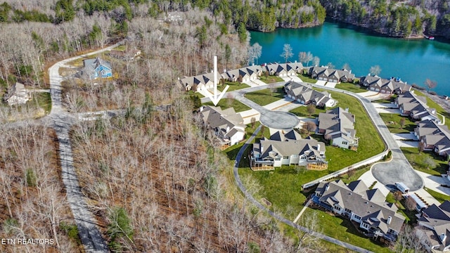 drone / aerial view with a residential view and a water view