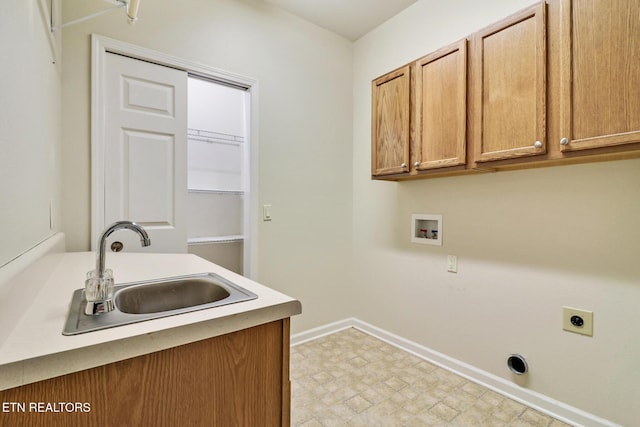 laundry area with a sink, light floors, cabinet space, hookup for an electric dryer, and hookup for a washing machine