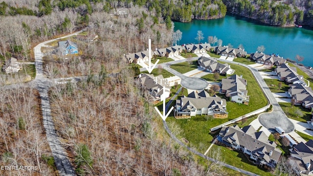 bird's eye view featuring a residential view and a water view