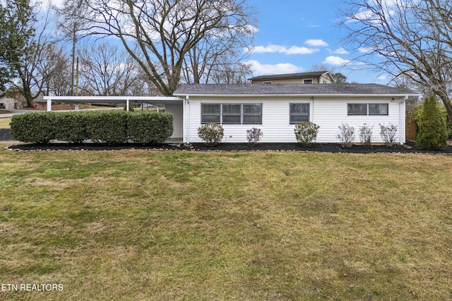 view of front of home featuring a carport and a front lawn