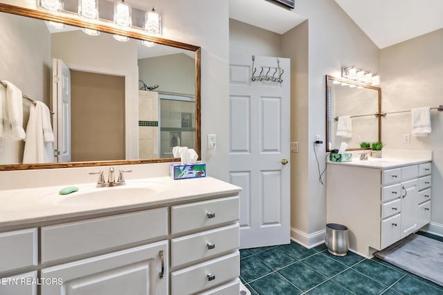 bathroom featuring walk in shower, tile patterned floors, and vanity