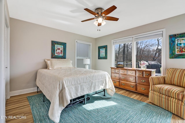 bedroom featuring hardwood / wood-style flooring and ceiling fan