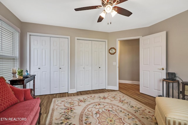 living area with ceiling fan and hardwood / wood-style floors