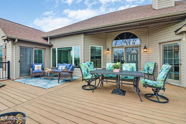 wooden deck with an outdoor hangout area