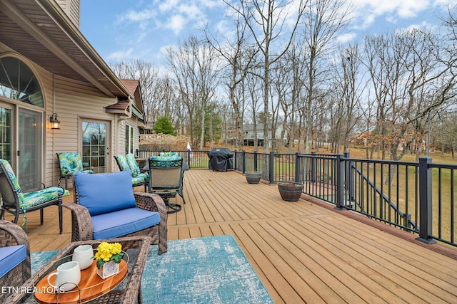 wooden deck featuring area for grilling