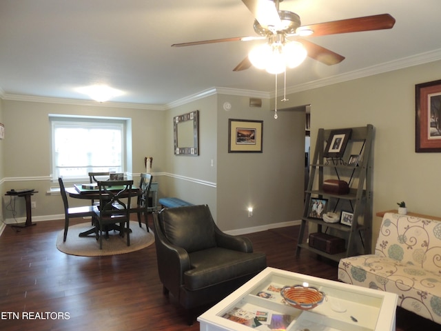 living room featuring ornamental molding, dark wood-type flooring, and ceiling fan