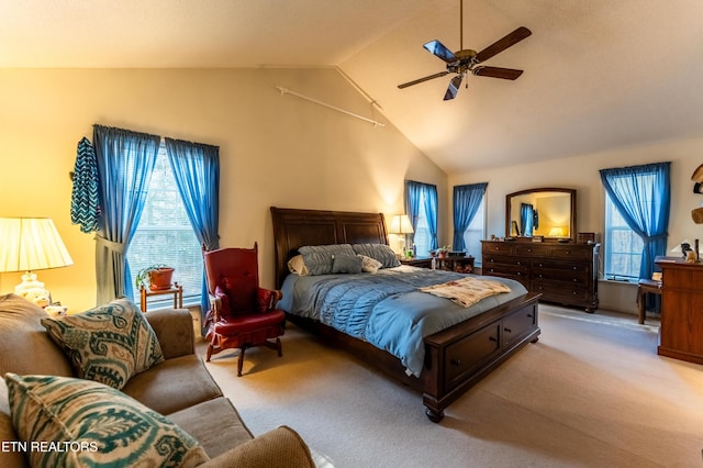 bedroom featuring lofted ceiling, light colored carpet, and ceiling fan