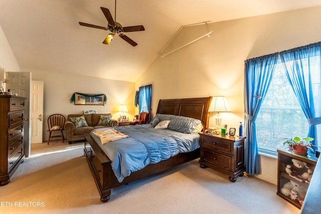 carpeted bedroom with high vaulted ceiling and ceiling fan