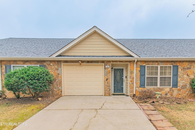 single story home featuring a garage