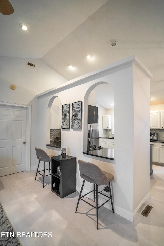 interior space featuring lofted ceiling