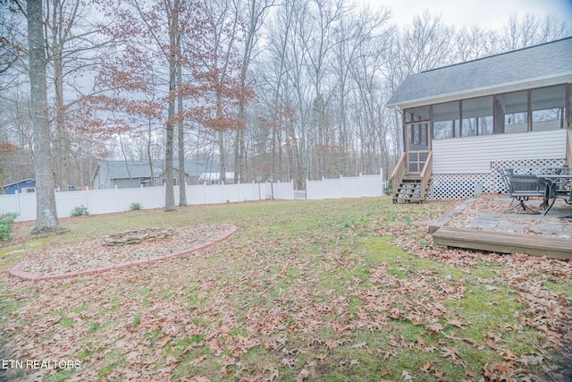 view of yard featuring a sunroom