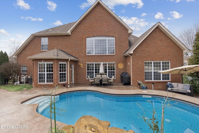 view of swimming pool with a patio and grilling area