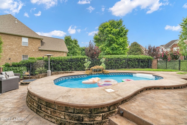 view of swimming pool featuring a patio area