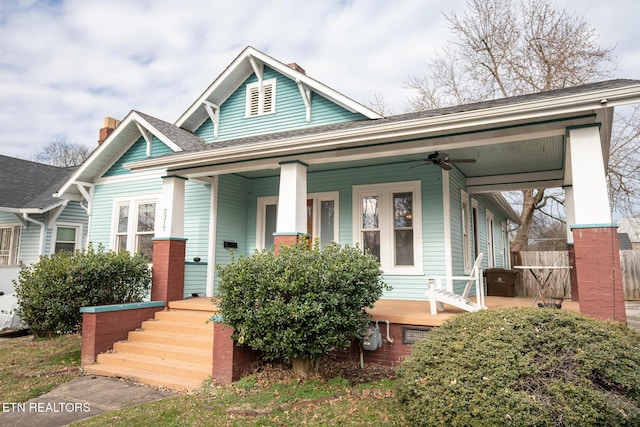 view of front of house with ceiling fan and a porch