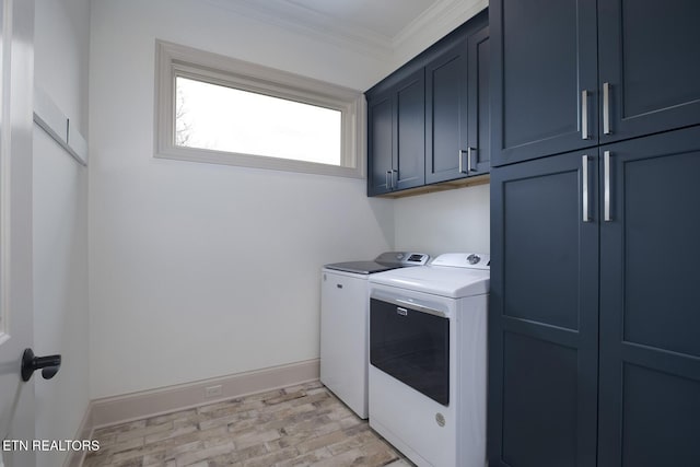 washroom with separate washer and dryer, baseboards, ornamental molding, light wood-type flooring, and cabinet space