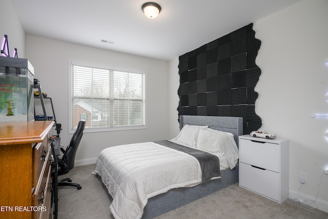 bedroom featuring light colored carpet