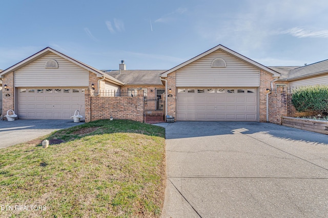 ranch-style house with a garage and a front lawn