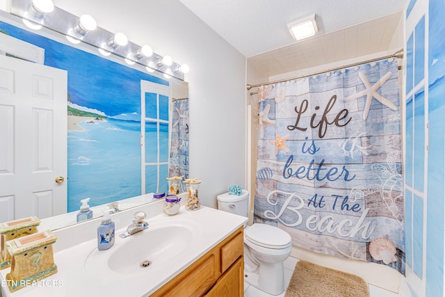 bathroom featuring vanity, toilet, tile patterned flooring, and a textured ceiling