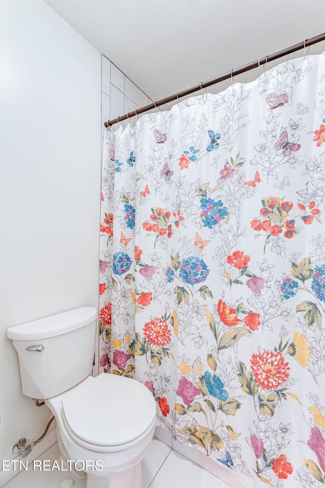 bathroom featuring tile patterned floors and toilet