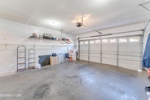 garage with a garage door opener and water heater