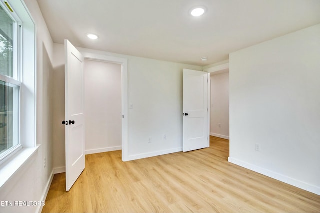 unfurnished bedroom featuring light hardwood / wood-style floors