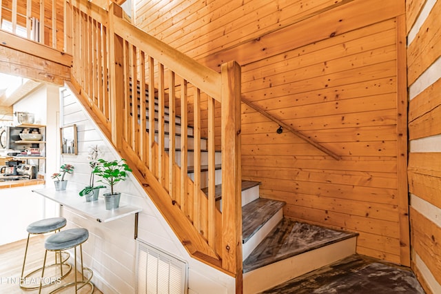 stairway with wooden walls