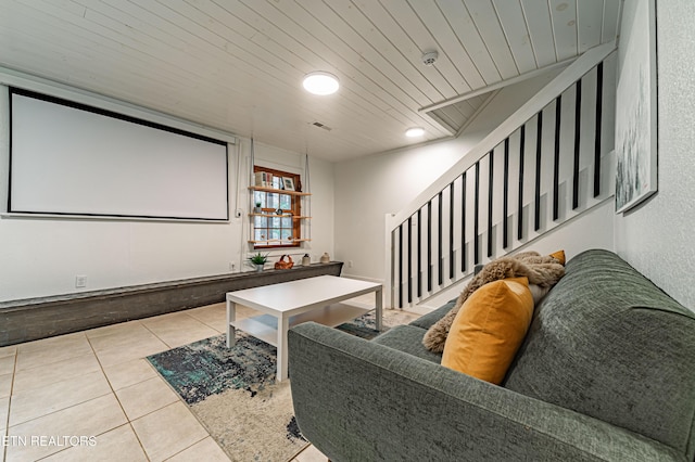 tiled cinema room featuring wood ceiling