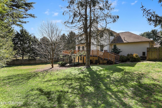 view of yard with a wooden deck