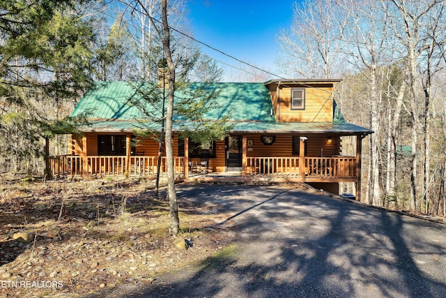 log cabin with covered porch