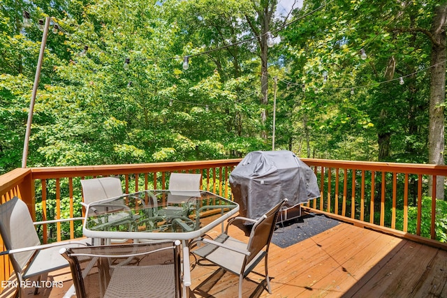 1521 Dawn Ln, Sevierville, TN 37876 - wooden deck with outdoor dining area and area for grilling