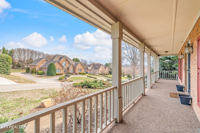 balcony featuring a residential view and a porch