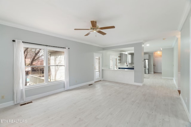 unfurnished living room with a ceiling fan, baseboards, visible vents, crown molding, and light wood-type flooring