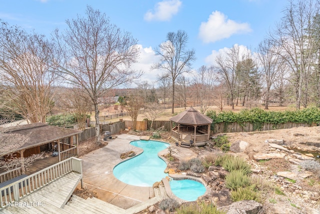 view of swimming pool featuring a gazebo, a fenced in pool, a fenced backyard, and a patio area