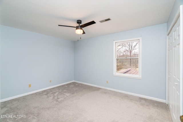 unfurnished bedroom featuring a ceiling fan, baseboards, visible vents, a closet, and carpet flooring