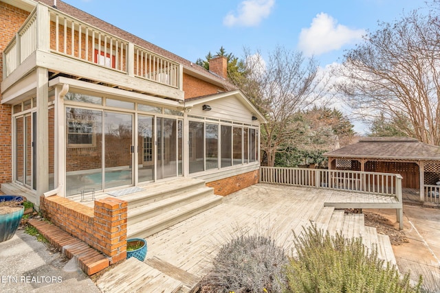 wooden terrace with a sunroom