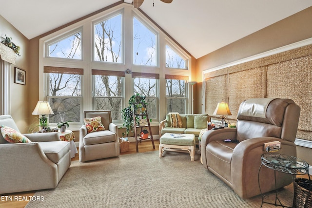 sunroom with lofted ceiling, plenty of natural light, and ceiling fan