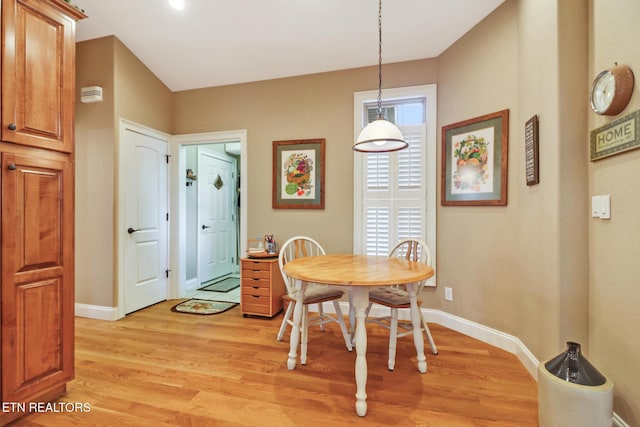 dining space with light wood-type flooring