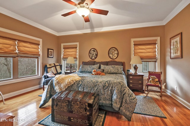 bedroom featuring ornamental molding, ceiling fan, and light hardwood / wood-style floors