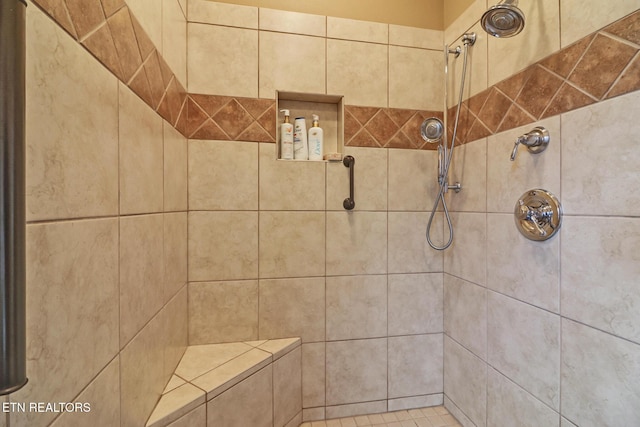 bathroom featuring tiled shower