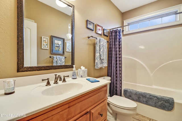 full bathroom with shower / bath combo, vanity, and toilet