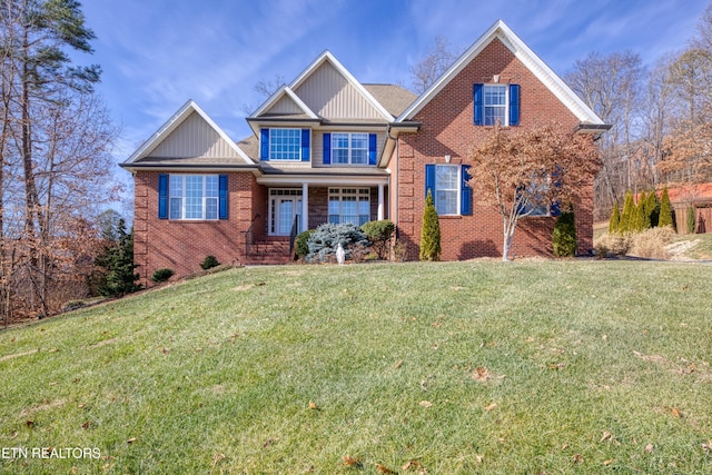 craftsman-style home with a front lawn