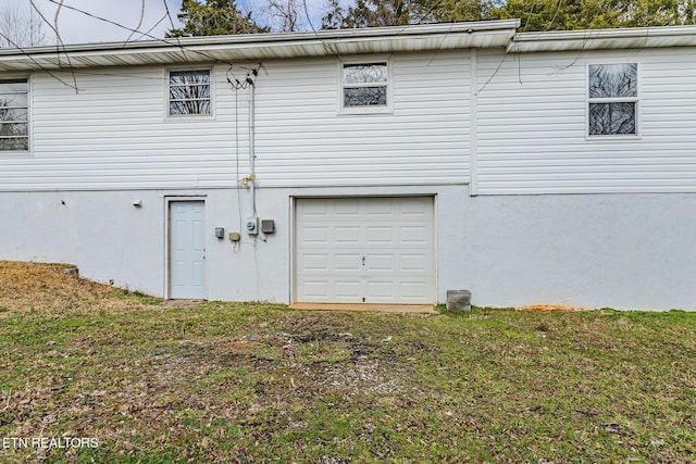 garage featuring a yard