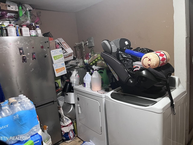 washroom with independent washer and dryer