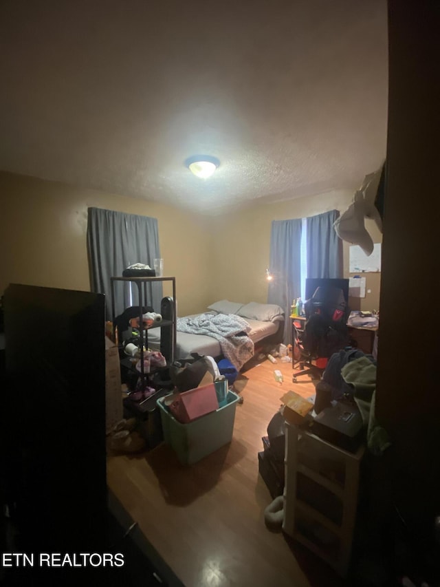 bedroom with wood-type flooring